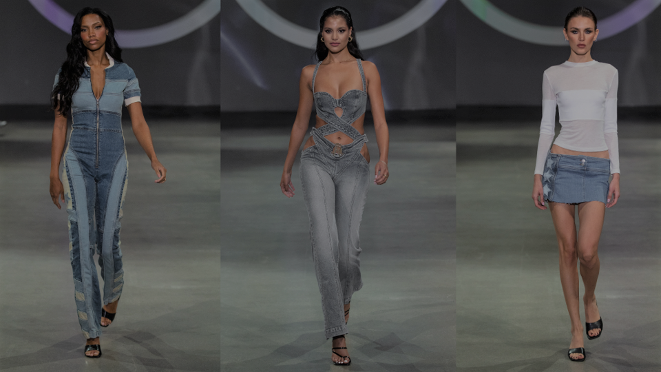 Three models walking down runway at fashion show
