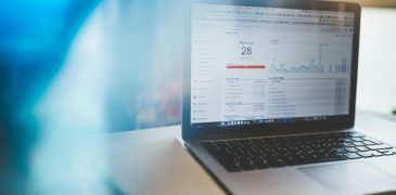 laptop open with website traffic analytics